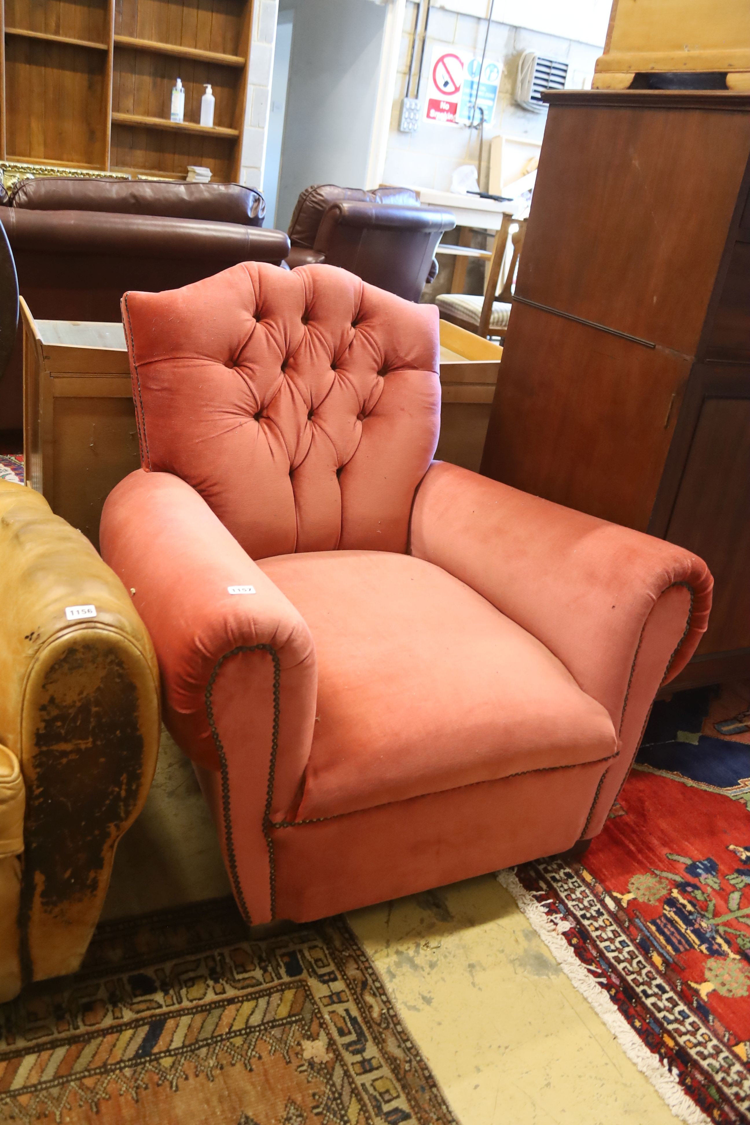 An early 20th century French armchair re-upholstered in pink dralon, width 86cm, depth 84cm, height 77cm